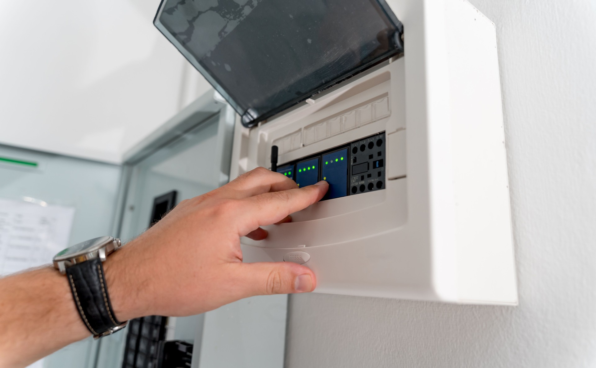 A technician works with a demo kit of the smart home system
